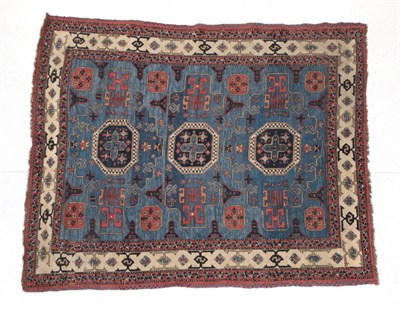 Lot 241 - Caucasian Design Rug Probably Afghanistan, modern The soft indigo field with three octagons...