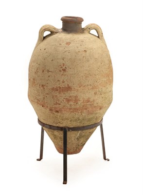Lot 246 - A Cream Glazed Terracotta Amphora, possibly Byzantine Empire, 5th century, of traditional ovoid...