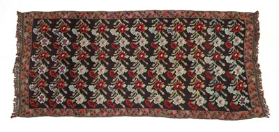 Lot 278 - Karabagh Kilim South Caucasus, 20th century The charcoal field with polychrome stylised plants...