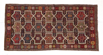 Lot 286 - Karabagh Rug South Caucasus, circa 1900 The charcoal field with three columns of linked...