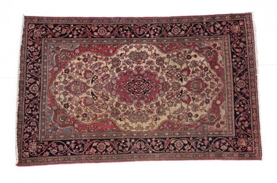 Lot 292 - Isfahan Rug Central Iran, circa 1920 The cream field of vines around a pole medallion framed by...