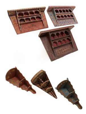 Lot 298 - A Moroccan Painted Wood Set of Wall Shelves, late 19th/20th century, with rectangular cornice...