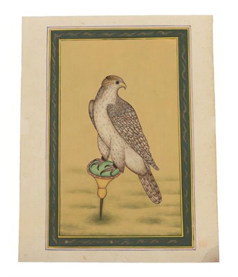 Lot 303 - Persian School (19th century) Study of a hawk perched on a stand within a scroll border Gouache...