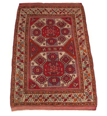 Lot 305 - Bergama Rug West Anatolia, circa 1920 The crimson field with two large octagons enclosed by...