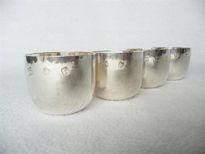 Lot 1471 - Leslie Gordon Durbin (b.1913): A Set of Four Silver Tots, with hand beaten exterior, maker's...