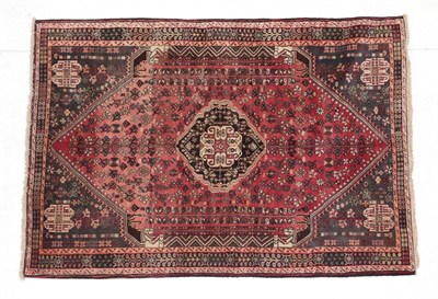 Lot 327 - Kashgai Rug South West Iran, circa 1970 The abrashed soft raspberry field with stylised plants...
