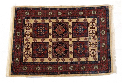 Lot 331 - West Iranian Village Rug, modern The ivory field with six panels enclosed by terracotta...