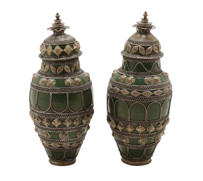 Lot 337 - A Pair of Persian White Metal Mounted Green Glazed Pottery Vases and Covers, early 20th century, of