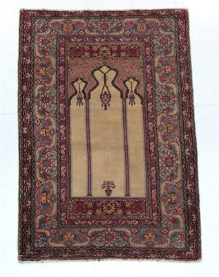 Lot 355 - Ladik Prayer Rug Central Turkey, 20th century The ivory field with lamp beneath the Mihrab enclosed