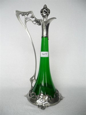 Lot 1477 - An Art Nouveau WMF Claret Jug, No.191, with tapering green glass body, the plated mounts cast...