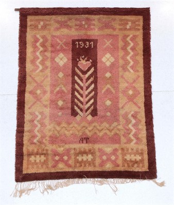 Lot 383 - European Hand-Knotted Rug, 1931 The narrow chocolate brown field with stylised plants enclosed...