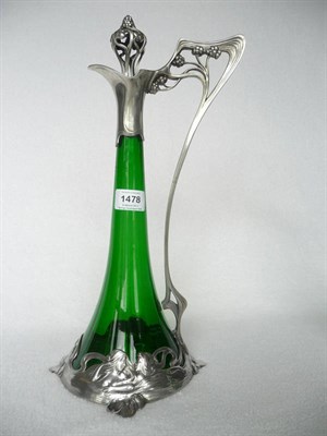 Lot 1478 - An Art Nouveau WMF Claret Jug, No.191, with tapering green glass body, the plated mounts cast...