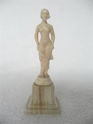 Lot 1480 - An Art Deco French Nude Ivory Figure, by Louis Sosson, modelled as a nude young woman holding a...