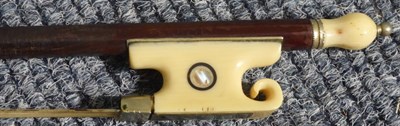 Lot 3035 - Violin Bow stamped 'Pecatte' [sic] ivory frog and button, length excluding button 720mm, weight 59g
