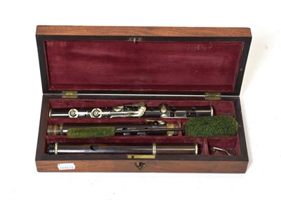 Lot 3036 - Flute By D'Almaine & Co. rosewood, six holes, eight keys, five sections, length 579mm (from...