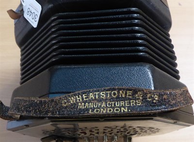 Lot 3048 - Concertina By C Wheatstone & Co 64 buttons, with metal endplates 8 1/4'' diameter, English...