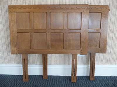 Lot 1499 - A Pair of Robert "Mouseman" Thompson Panelled Oak Single Divan Headboards, with brackets, each with