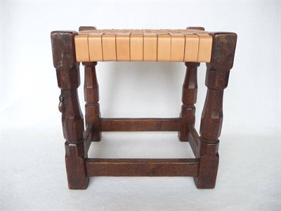 Lot 1500 - A Robert "Mouseman" Thompson Oak Stool, on four octagonal legs, joined by a stretcher, with...