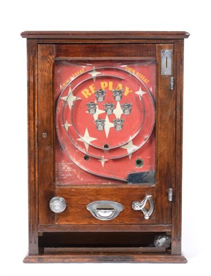 Lot 3210 - Replay Wall Mounted Amusement Machine with red ground with eight winning cups and 'Coin Repeat'...