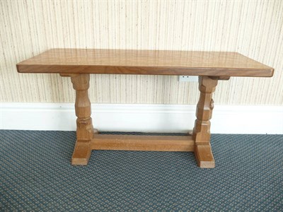 Lot 1505 - A Robert "Mouseman" Thompson Oak 3ft Rectangular Coffee Table, on two octagonal legs joined by...