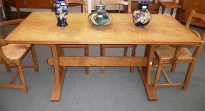 Lot 1510 - An Alan Grainger Acorn Industries Oak Refectory Table, on two supports joined by a central...