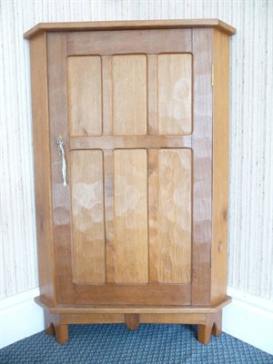 Lot 1514 - An Alan Grainger Acorn Industries Oak Floor Standing Corner Cupboard, with shelved interior,...