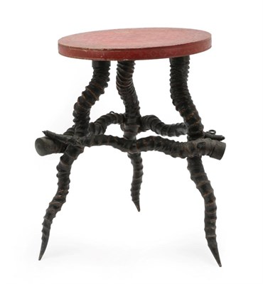 Lot 164 - Horn Furniture: An Indian Blackbuck Horn Table, circa 1900, the cinnabar circular top above...