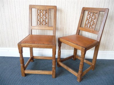 Lot 1519 - A Pair of Sid Pollard Oak Lattice Back Chairs, with tan cow hide seats, on turned octagonal...