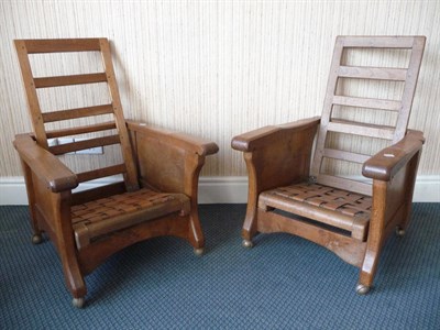 Lot 1520 - A Matched Pair of Sid Pollard Oak Adjustable Smoker's Chairs, with slatted backs, tan leather woven