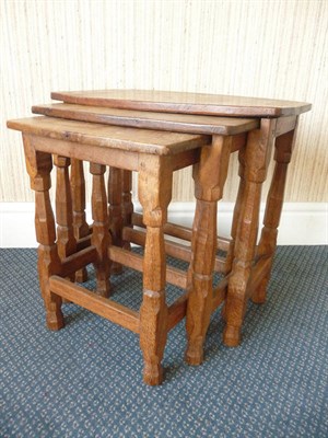 Lot 1521 - A Sid Pollard Oak Nest of Tables, with shaped rectangular tops, on turned octagonal legs joined...