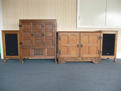 Lot 1525 - A Sid Pollard Oak Television Cabinet, with panelled folding doors, wrought iron fittings, unmarked