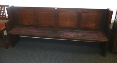 Lot 1528 - A Pair of Martin "Lizardman" Dutton Oak Pews, with stepped ends, panelled back, upholstered...