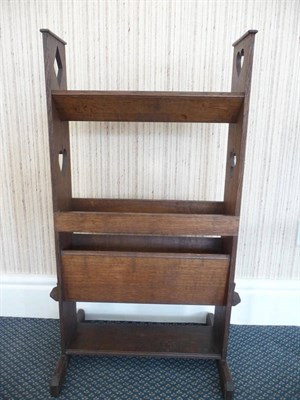 Lot 1533 - An Arts & Crafts Oak Book Rack, with a "V" trough above another trough, with a shelf below, the...