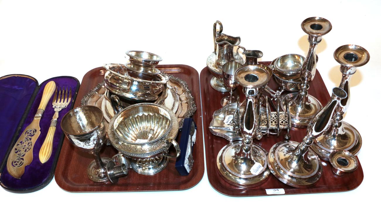 Lot 34 - A collection of assorted silver-plate, including: a set of four candlesticks, one damaged;...