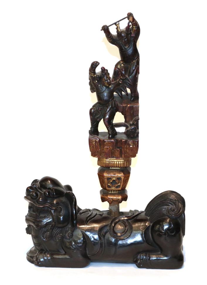 Lot 44 - A Chinese carved rootwood dog of Fo, with an associated finial, carved with dancing figures