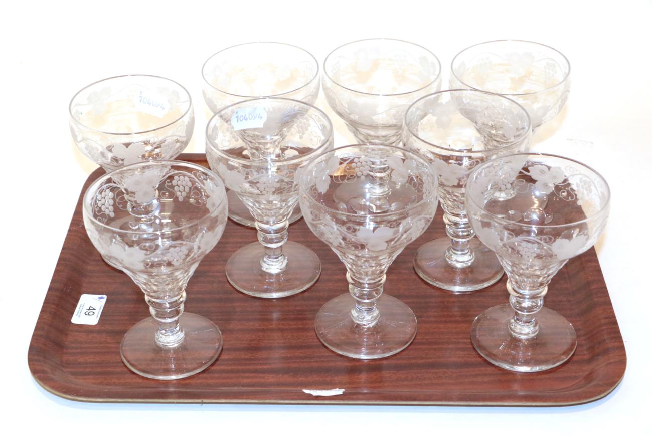 Lot 49 - A set of nine 19th century stemmed wine glasses, etched grape and vine design (9)