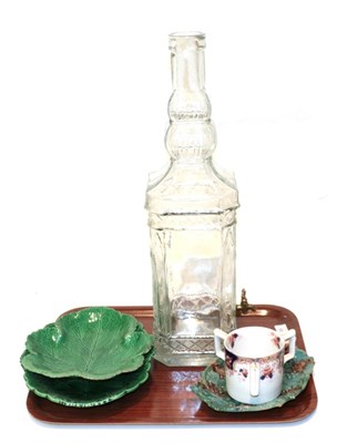 Lot 99 - A reproduction Leeds ware matrimony mug; Victorian Wedgwood leaf dishes; a bar top decanter in...