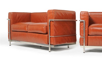 Lot 1541 - A Modern Pair of Le Corbusier LC2 Sofas, polished chromed steel frame with tan/brown  leather...