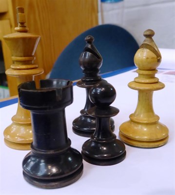 Lot 133 - A complete ebony and boxwood chess set, late 19th/early 20th century, boxed; together with a...