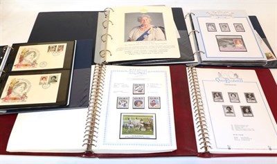 Lot 135 - Box containing commemorative stamps: Queen Mother 90/100th birthday issues; two red albums; and two