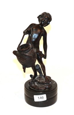 Lot 146 - A bronze figure of a child carrying a basket, raised on a marble plinth, signed