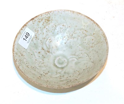 Lot 149 - A Chinese celadon glaze bowl, possibly Song dynasty, incised cloud decoration, 17cm diameter