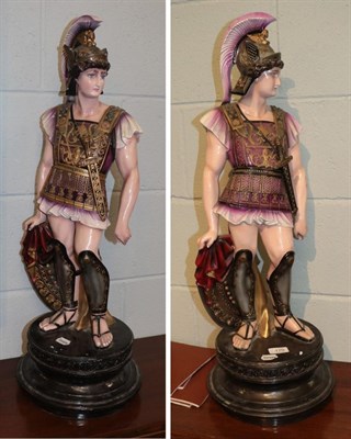 Lot 170 - A pair of reproduction painted plaster models of centurions