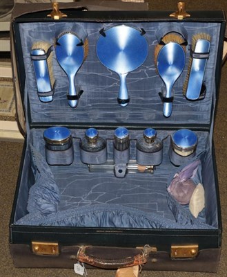 Lot 187 - Case with silver and enamel bottles