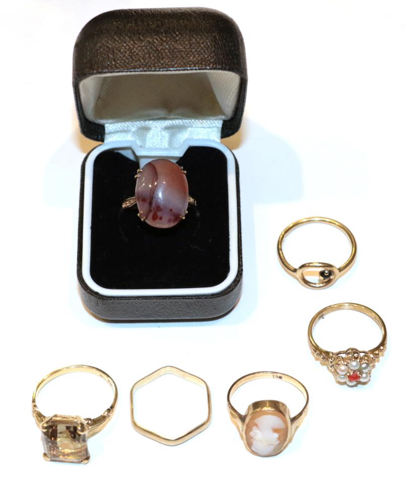 Lot 263 - A cameo ring, stamped '9CT', finger size M; a 9 carat gold hexagonal shaped band ring; a 9...
