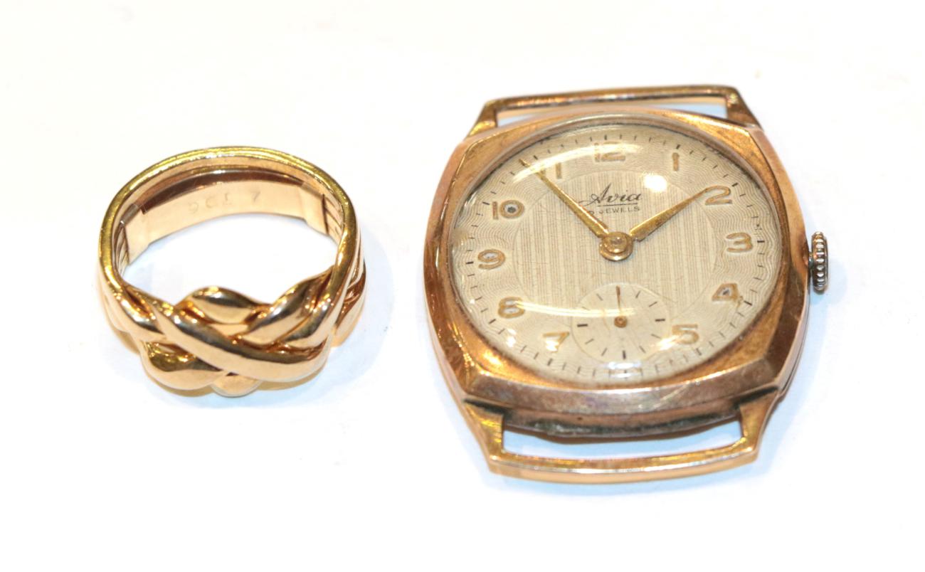 Lot 266 - A 9 carat gold puzzle ring, finger size L; and a watch face