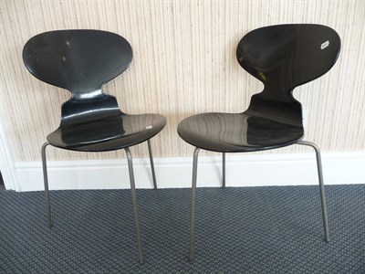 Lot 1557 - A Pair of Arne Jacobsen Ant Chairs, model No.3100, made by Fritz Hansen, painted black plywood...