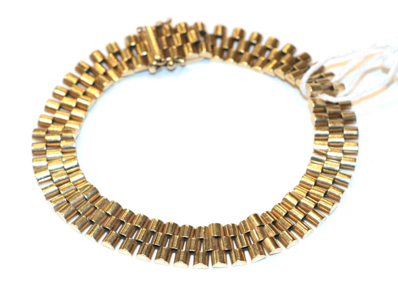 Lot 268 - A 9 carat gold brick link bracelet, length 20cm