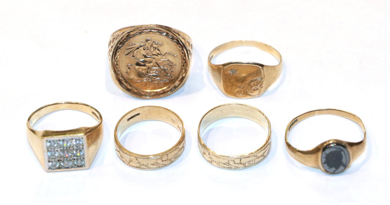 Lot 273 - Two 9 carat gold patterned band rings, finger sizes N and Q; a St George coin ring in a 9 carat...