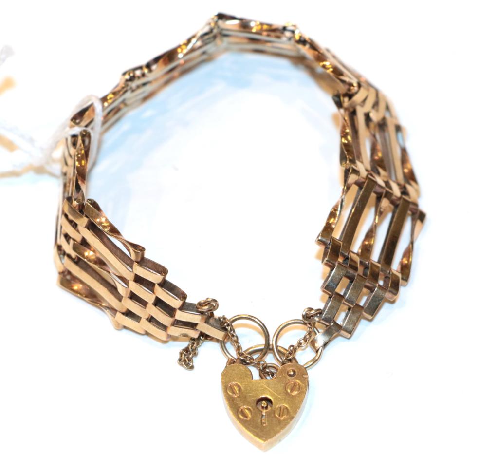 Lot 275 - A gate bracelet with a 9 carat gold padlock clasp, length 19cm